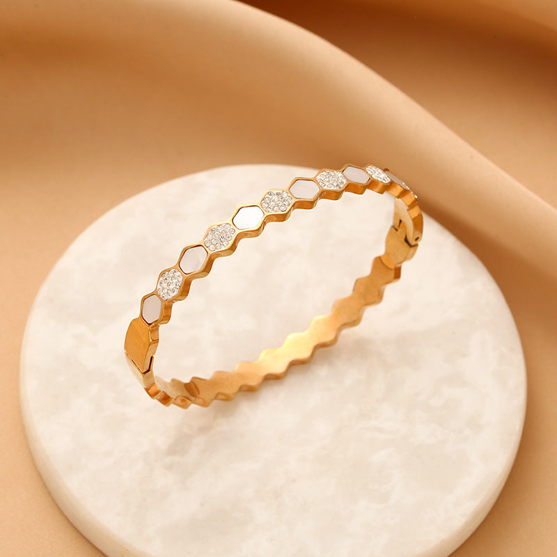 Hexagonal rose gold-tone titanium bracelet with zircons