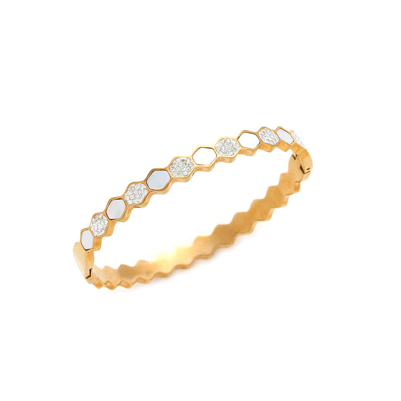 Hexagonal rose gold-tone titanium bracelet with zircons